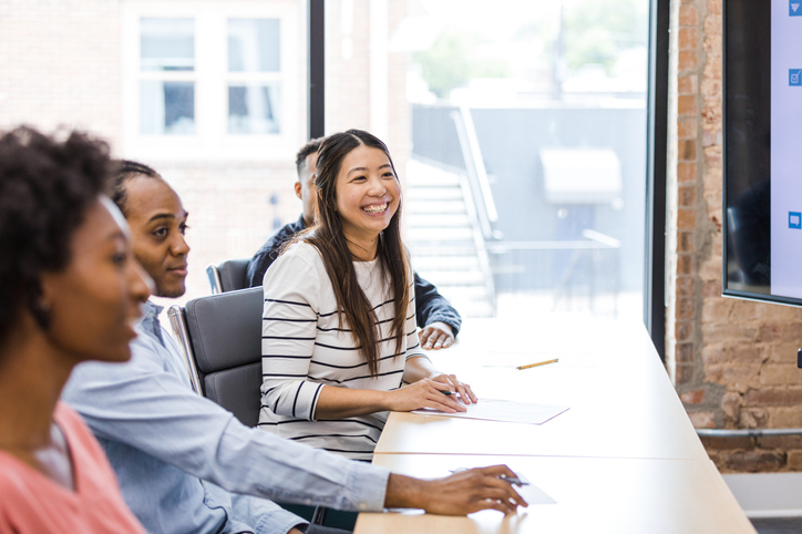 employees attend an event in a conference room